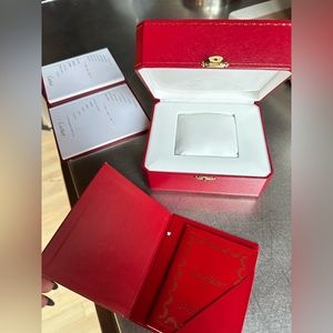 Cartier watch box and instruction manual.